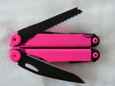 Hot pink powdercoated Leatherman front view closed with blades spread